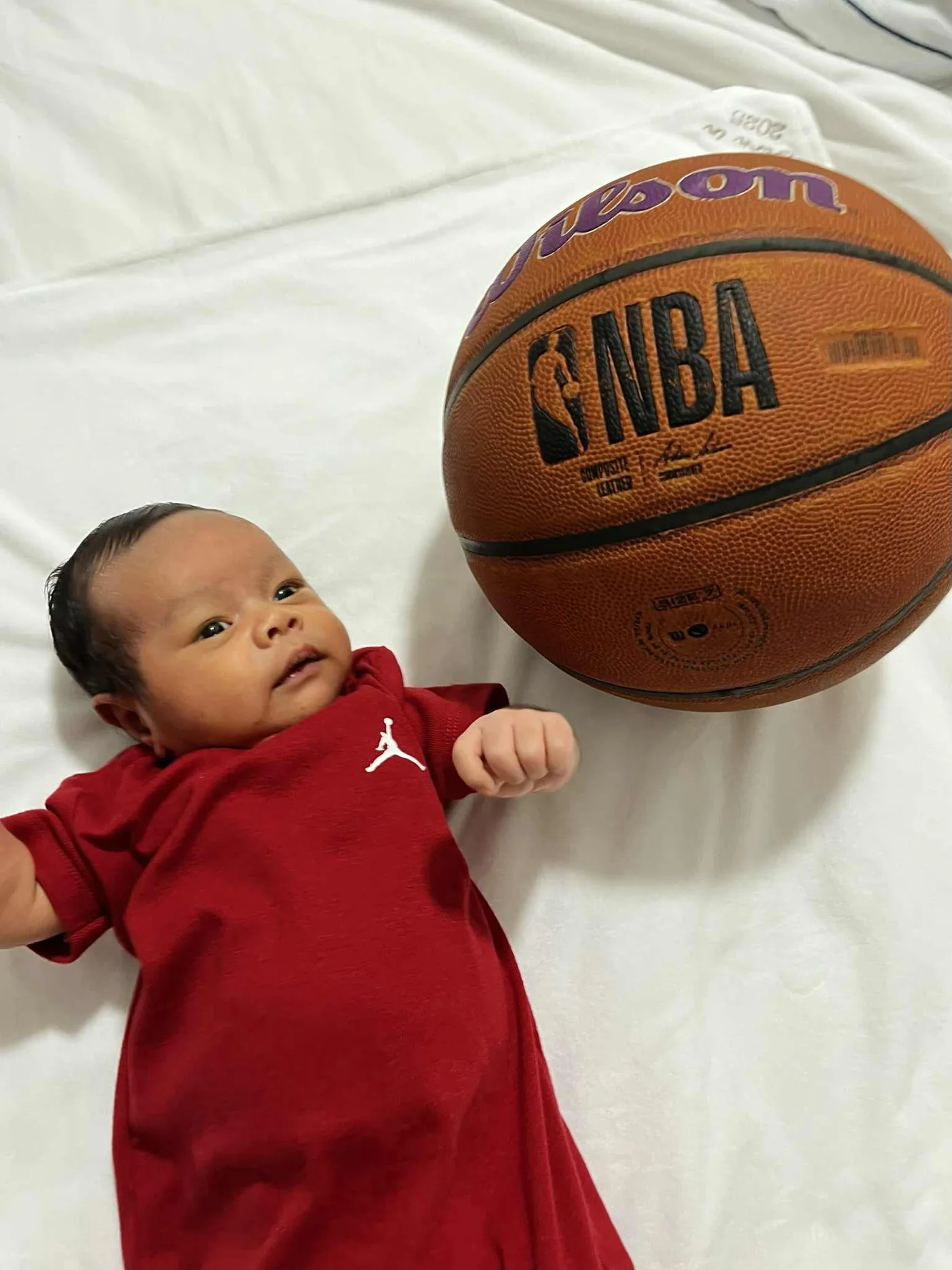 Kensho beside a basketball